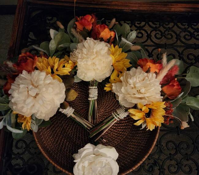 Rustic wedding floral bouquets with white peonies and sunflowers prepared for a wedding at Three Willows Ranch in Colorado