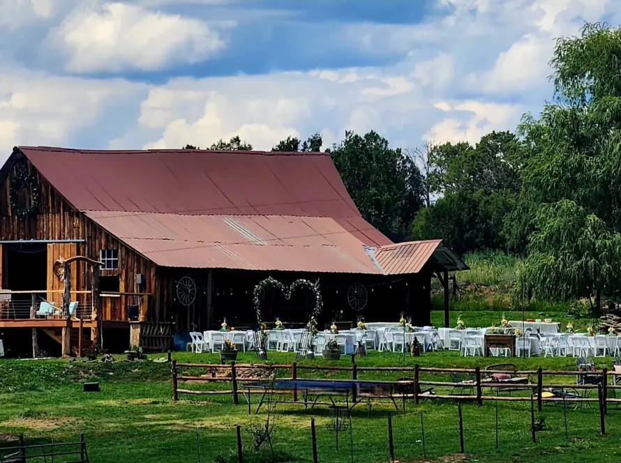 Rustic barn wedding venue with outdoor ceremony setup at Three Willows Ranch in Colorado