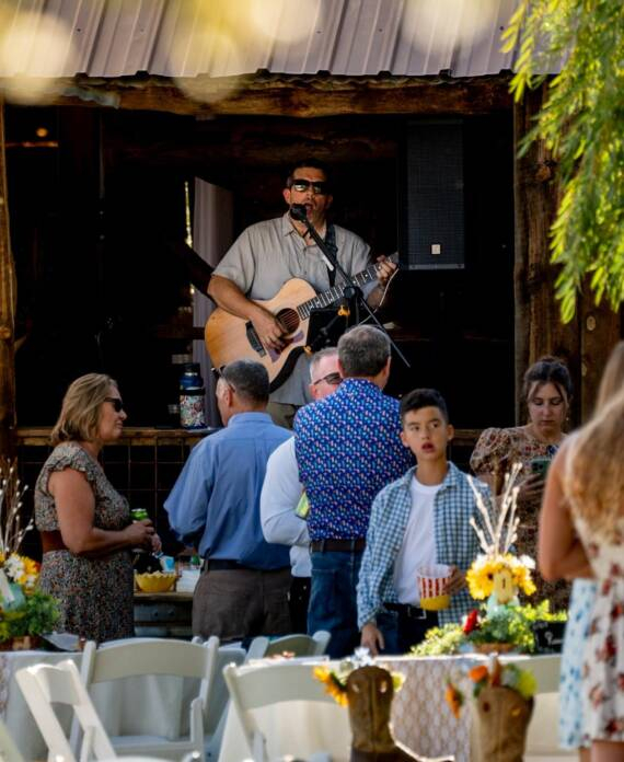Live acoustic music performance during an outdoor event at Three Willows Ranch rustic barn venue in Bayfield Colorado