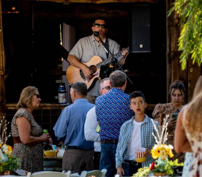 Live acoustic music performance during an outdoor event at Three Willows Ranch rustic barn venue in Bayfield Colorado