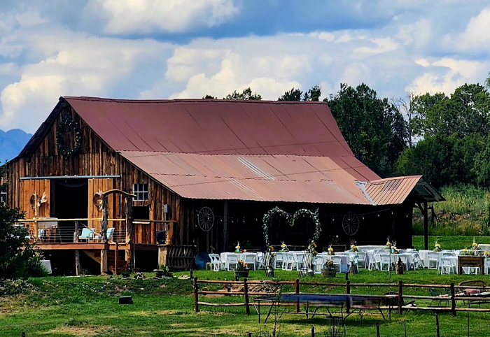 Rustic barn wedding venue with outdoor ceremony setup at Three Willows Ranch in Colorado