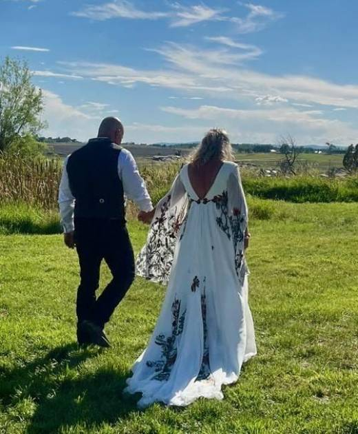 couple-walking-ranch-field-bayfield-colorado